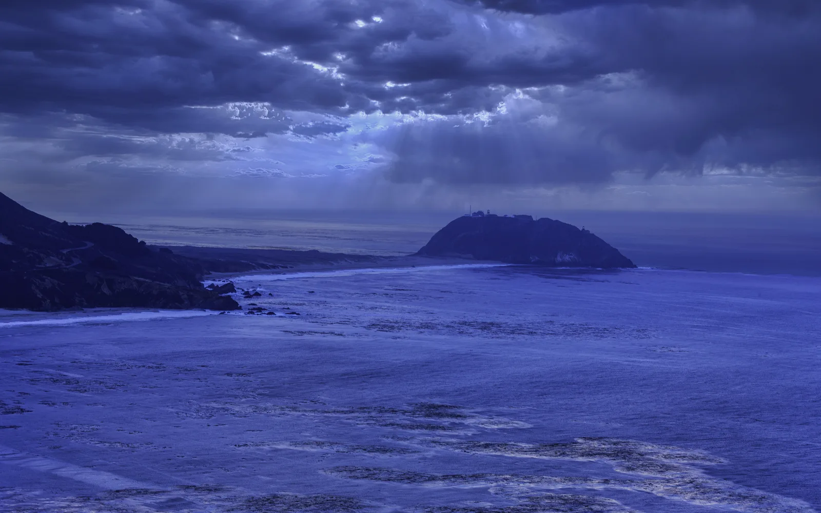 California coastal landscape showing cliffs and Pacific Ocean under clear sky